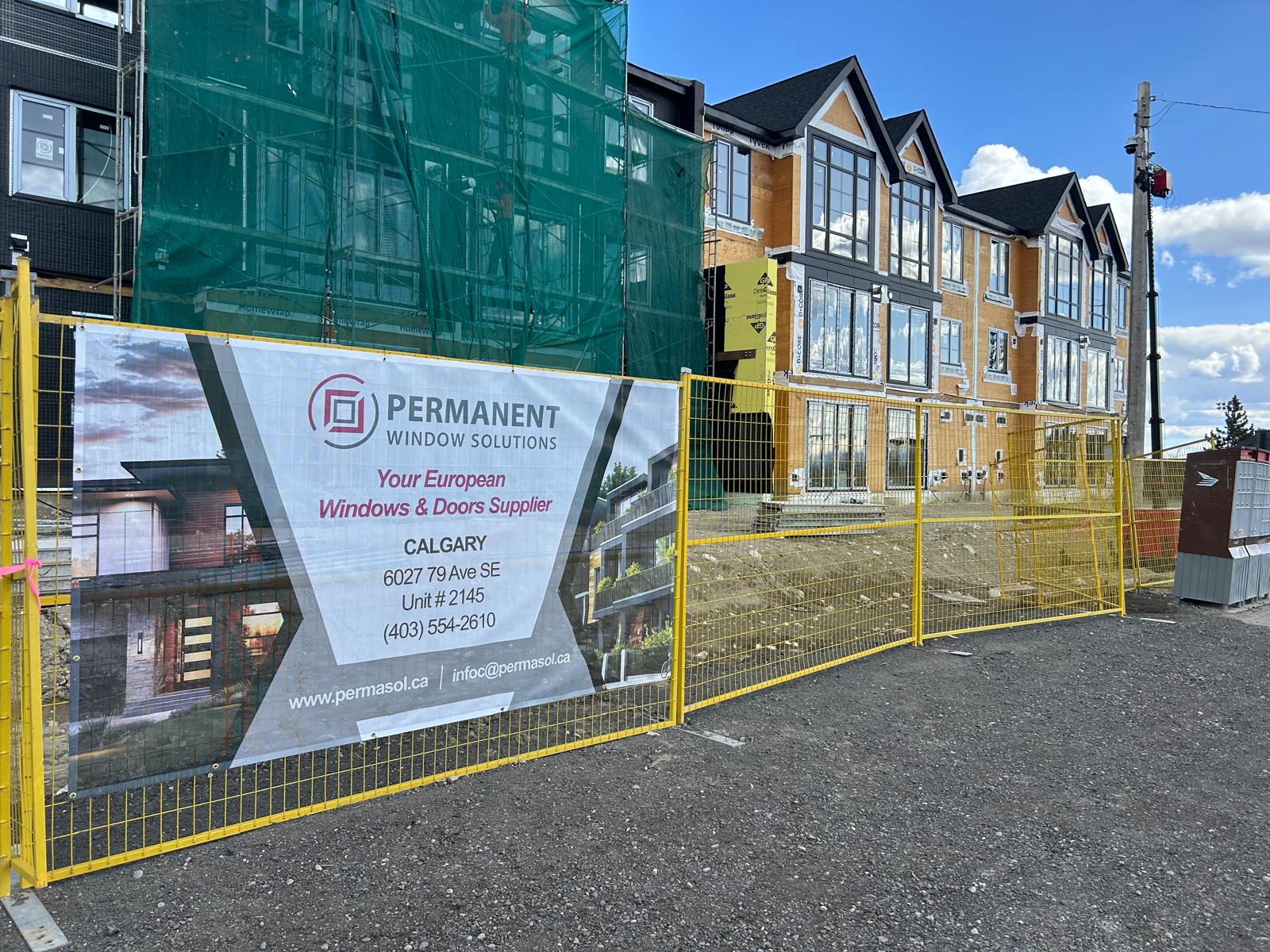 Branded banner at multi-unit commercial construction site