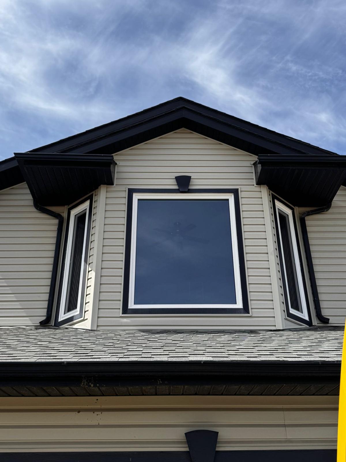 South gable — fixed picture window flanked by narrow casements