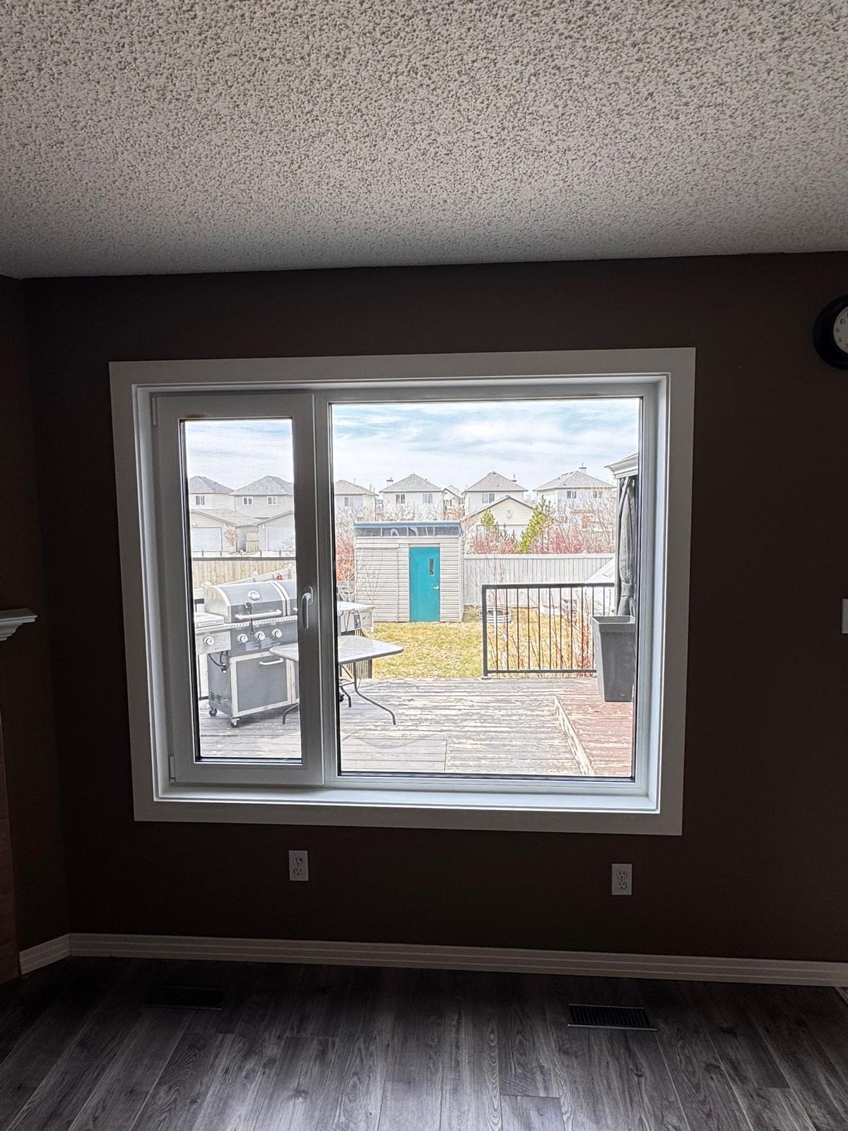 Dining room picture + slider looking onto deck