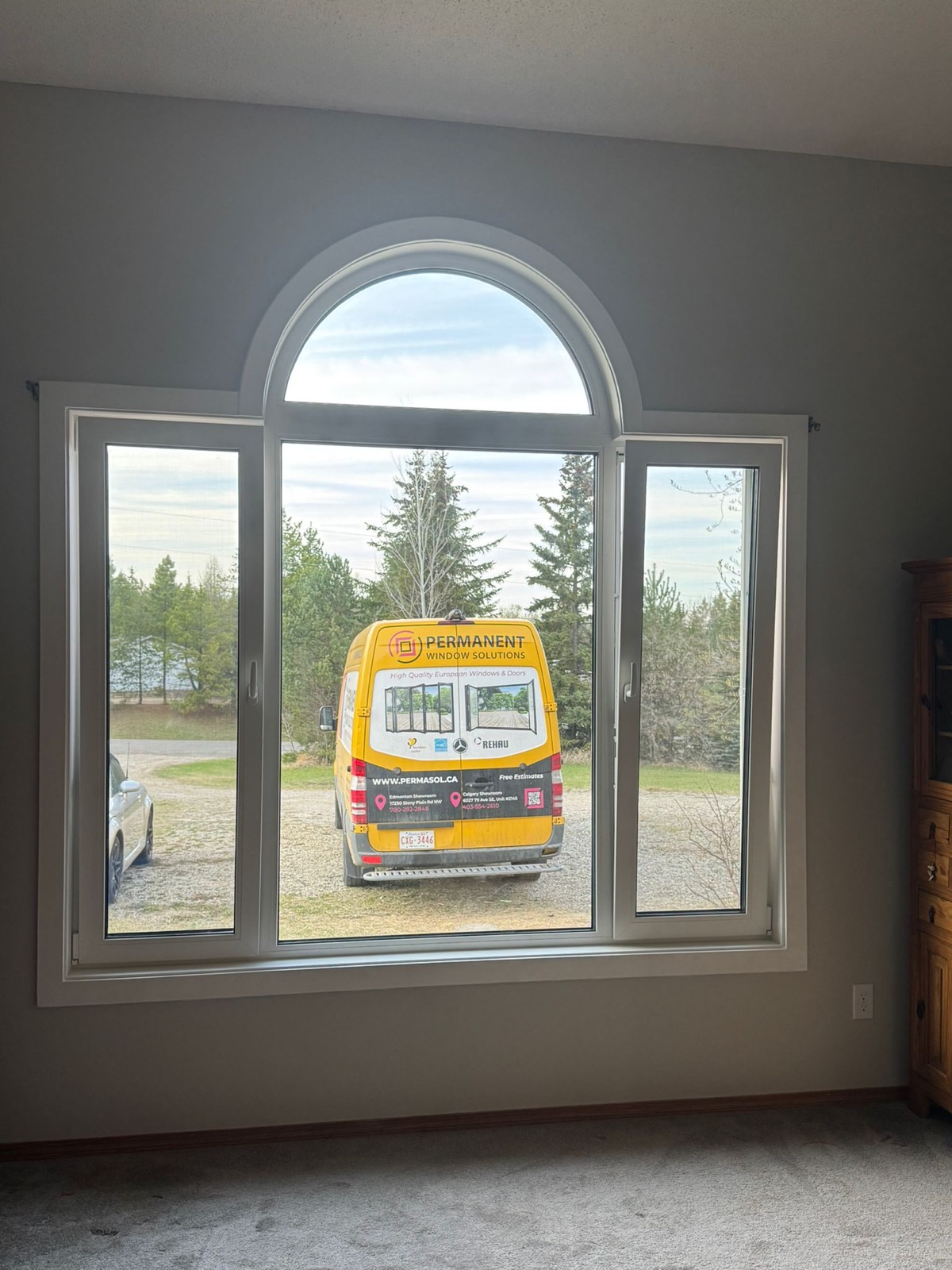 Arch-top picture window from inside framing