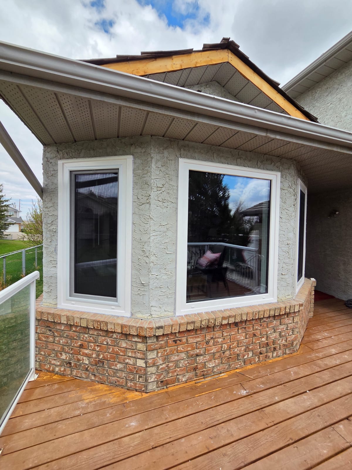 Bay window second angle — full deck width and brick base