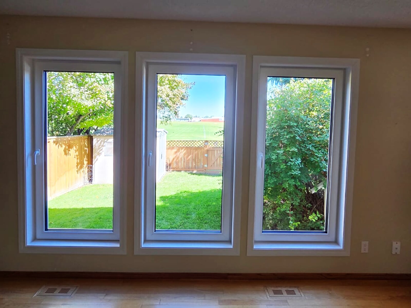 Three tilt-and-turn windows in a living room, interior view